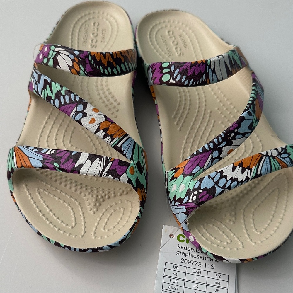 CROCS 
kadeell butterfly graphic sandal for Girl 4 W Multicolor Strappy Sandals